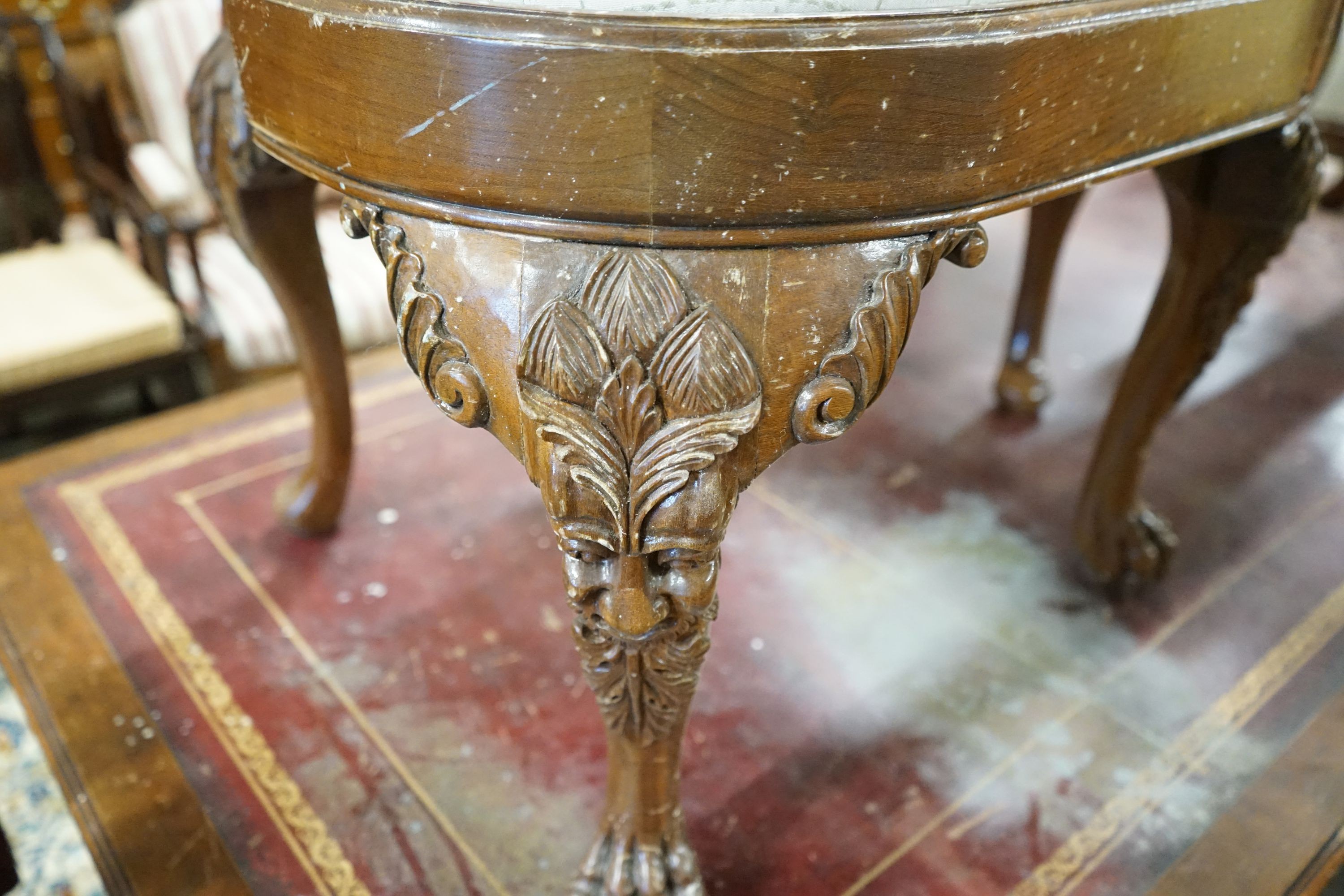 A set of twelve George II style carved walnut dining chairs, two with arms